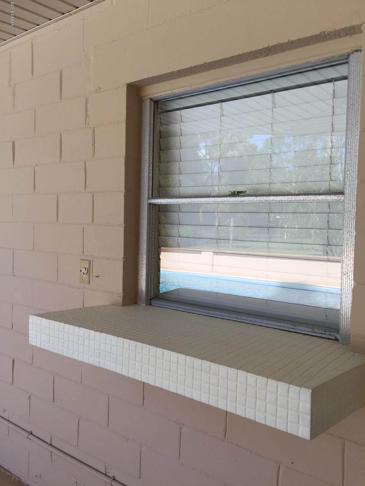 711 Taylor Road Port Orange, FL 32127 - Photo 5 of 12 Passthrough from kitchen
