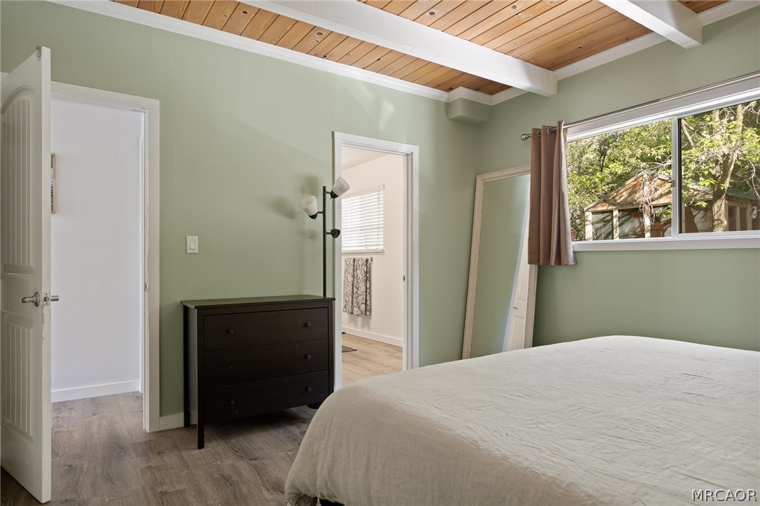 316 Pioneer Road Lake Arrowhead, CA 92352 - Photo 12 of 35 a bedroom with a bed and a window