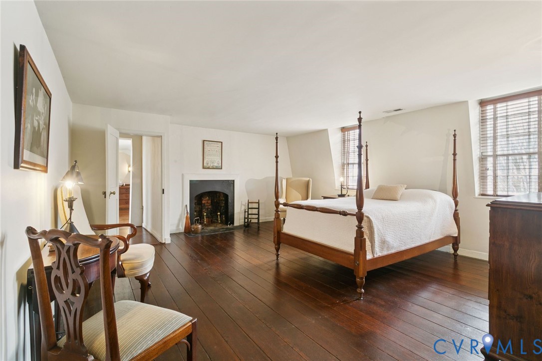 1685 Sweet Hall Road West Point, VA 23181 - Photo 38 of 47 Second floor bedroom with a fireplace and water vi