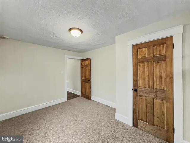 an empty room with entrance door