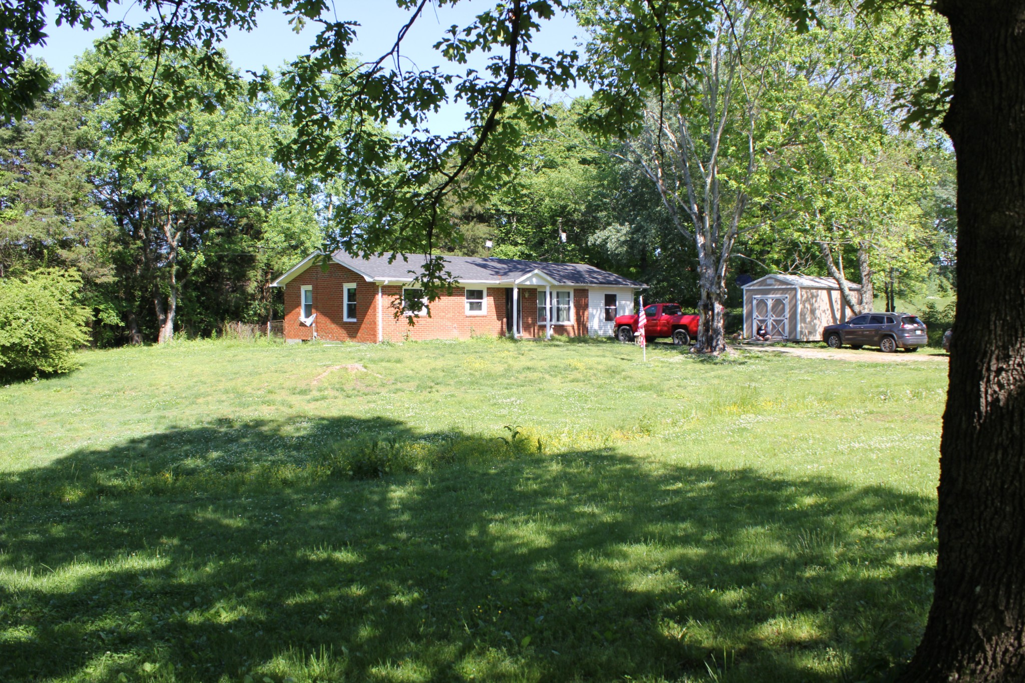 205 Locust Road Erin, TN 37061 - Photo 2 of 17 a view of a house with a big yard