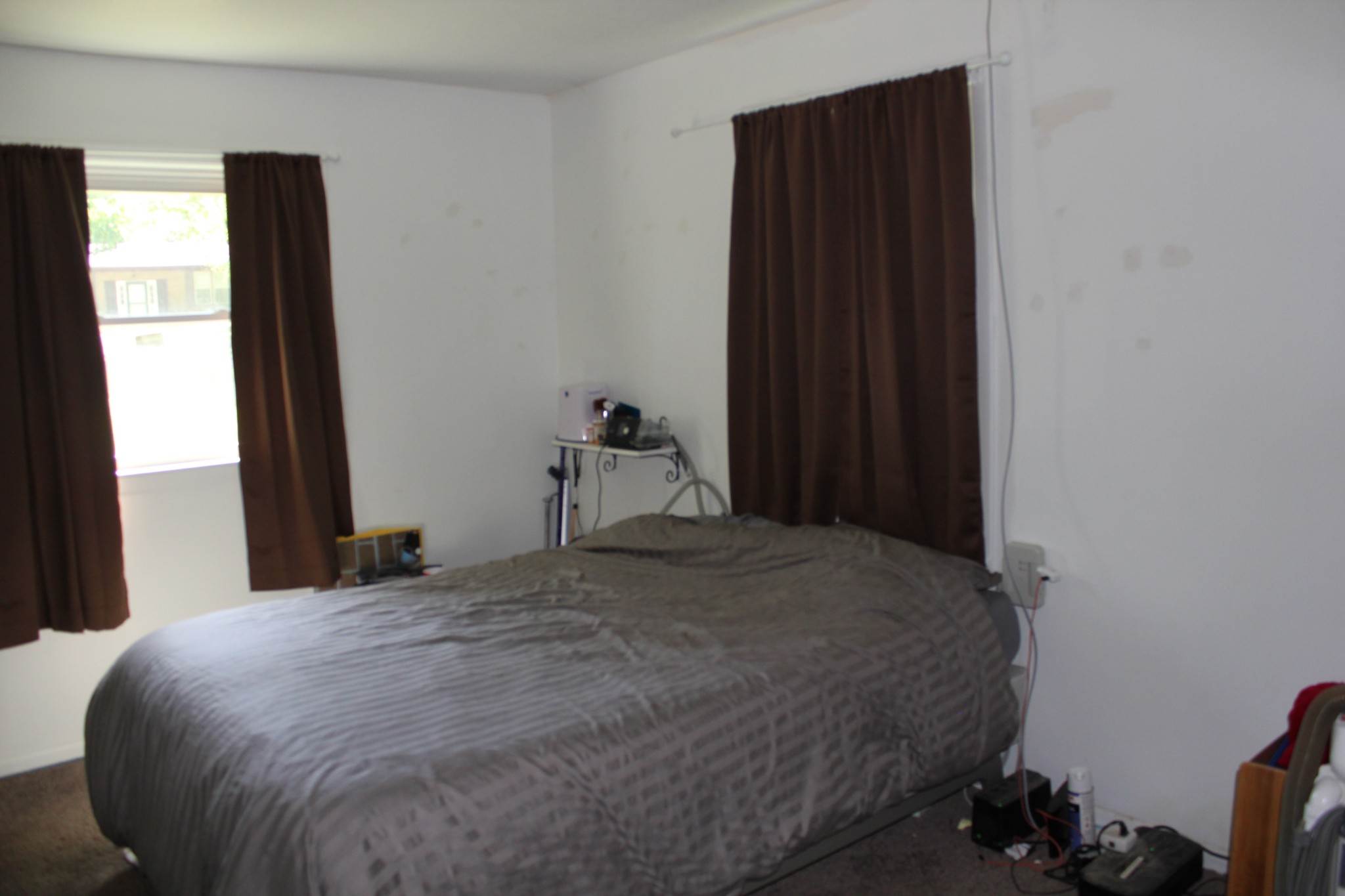 205 Locust Road Erin, TN 37061 - Photo 11 of 17 a bed sitting in a bedroom next to a window