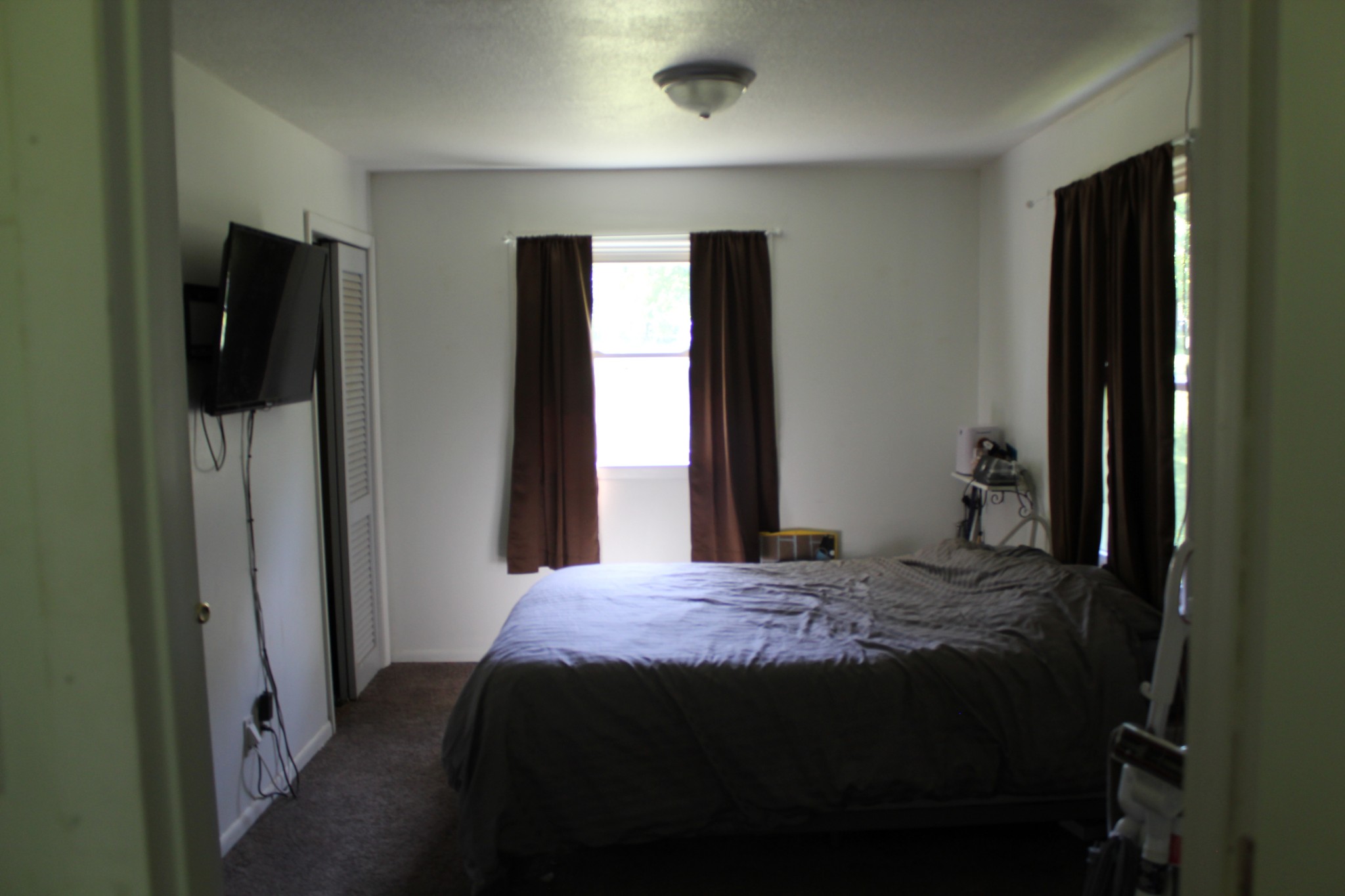 205 Locust Road Erin, TN 37061 - Photo 12 of 17 a bedroom with a bed and a window