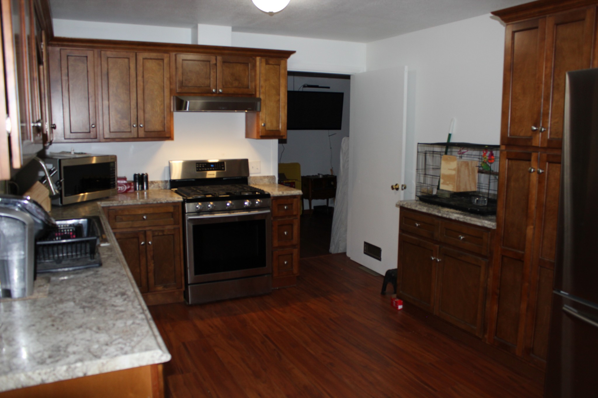 205 Locust Road Erin, TN 37061 - Photo 14 of 17 a kitchen with a stove and a microwave