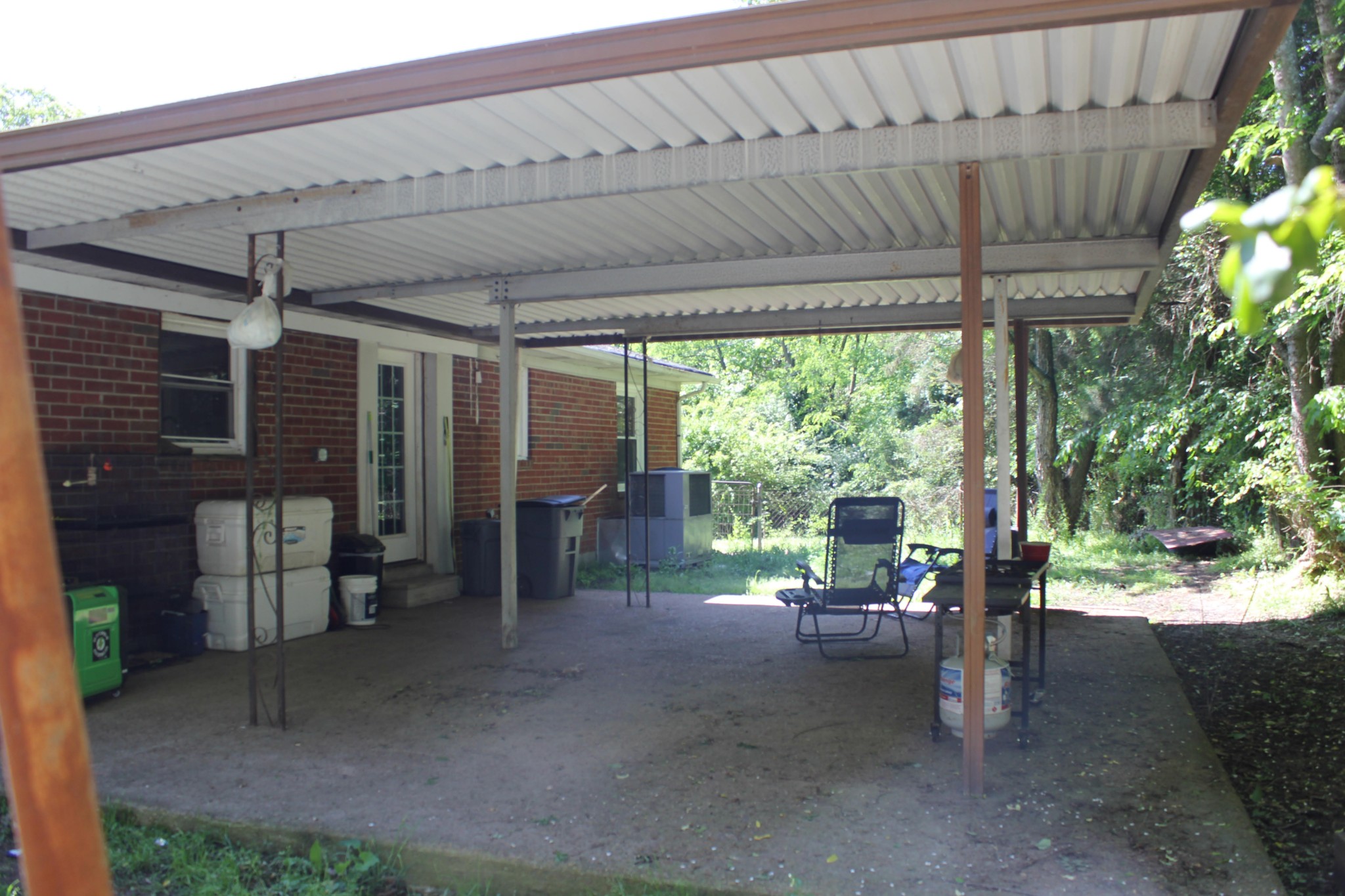 205 Locust Road Erin, TN 37061 - Photo 7 of 17 a view of a patio with table and chairs potted plants with wooden floor