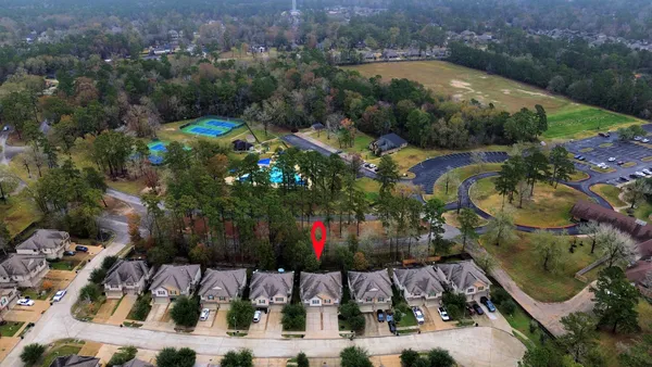 an aerial view of residential house with outdoor space and swimming pool