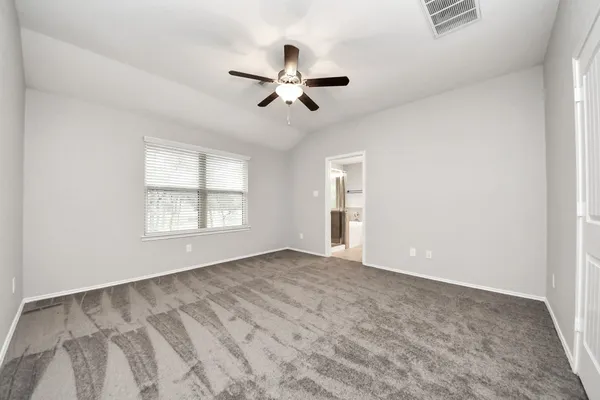 a white bath tub sitting in a bathroom next to a window
