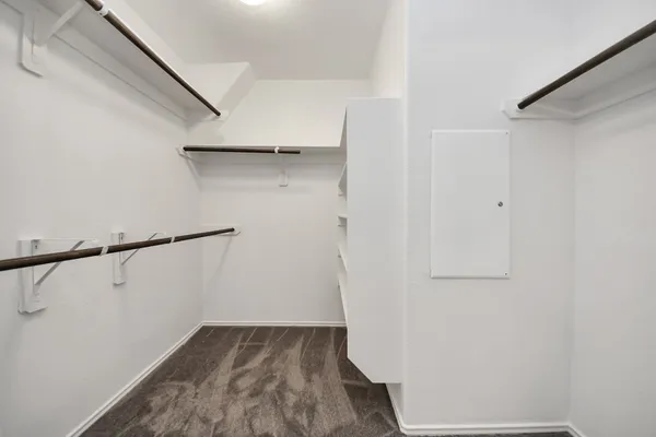 a spacious bathroom with a granite countertop sink and a mirror