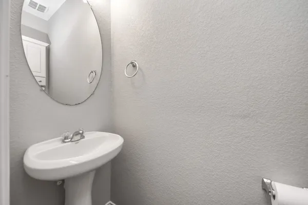a view of entryway and gallery with wooden floor