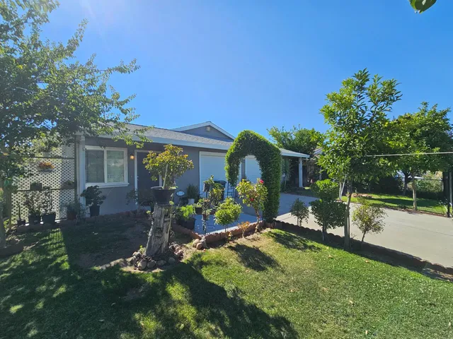 front view of a house with a yard