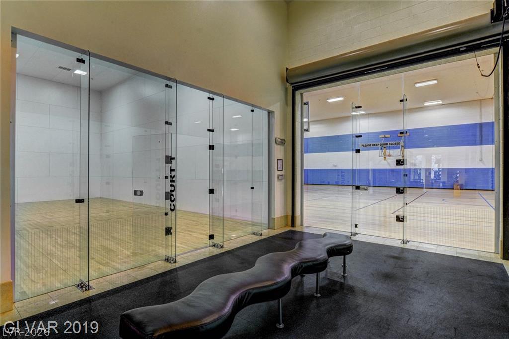 87 Tall Ruff Drive Las Vegas, NV 89148 - Photo 22 of 71 Professional-grade sports facilities include a squash court and a full basketball court.