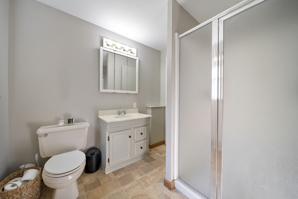 41 Searle Street Georgetown, MA 01833 - Photo 14 of 26 a bathroom with a toilet sink and mirror