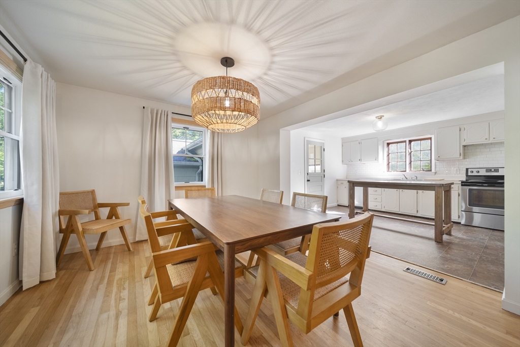 41 Searle Street Georgetown, MA 01833 - Photo 2 of 26 a view of a dining room with furniture window and wooden floor