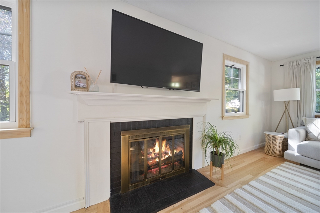 41 Searle Street Georgetown, MA 01833 - Photo 8 of 26 a living room with furniture and a fireplace