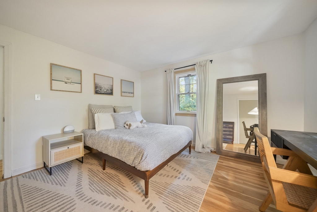 41 Searle Street Georgetown, MA 01833 - Photo 10 of 26 a bedroom with a bed and a large mirror