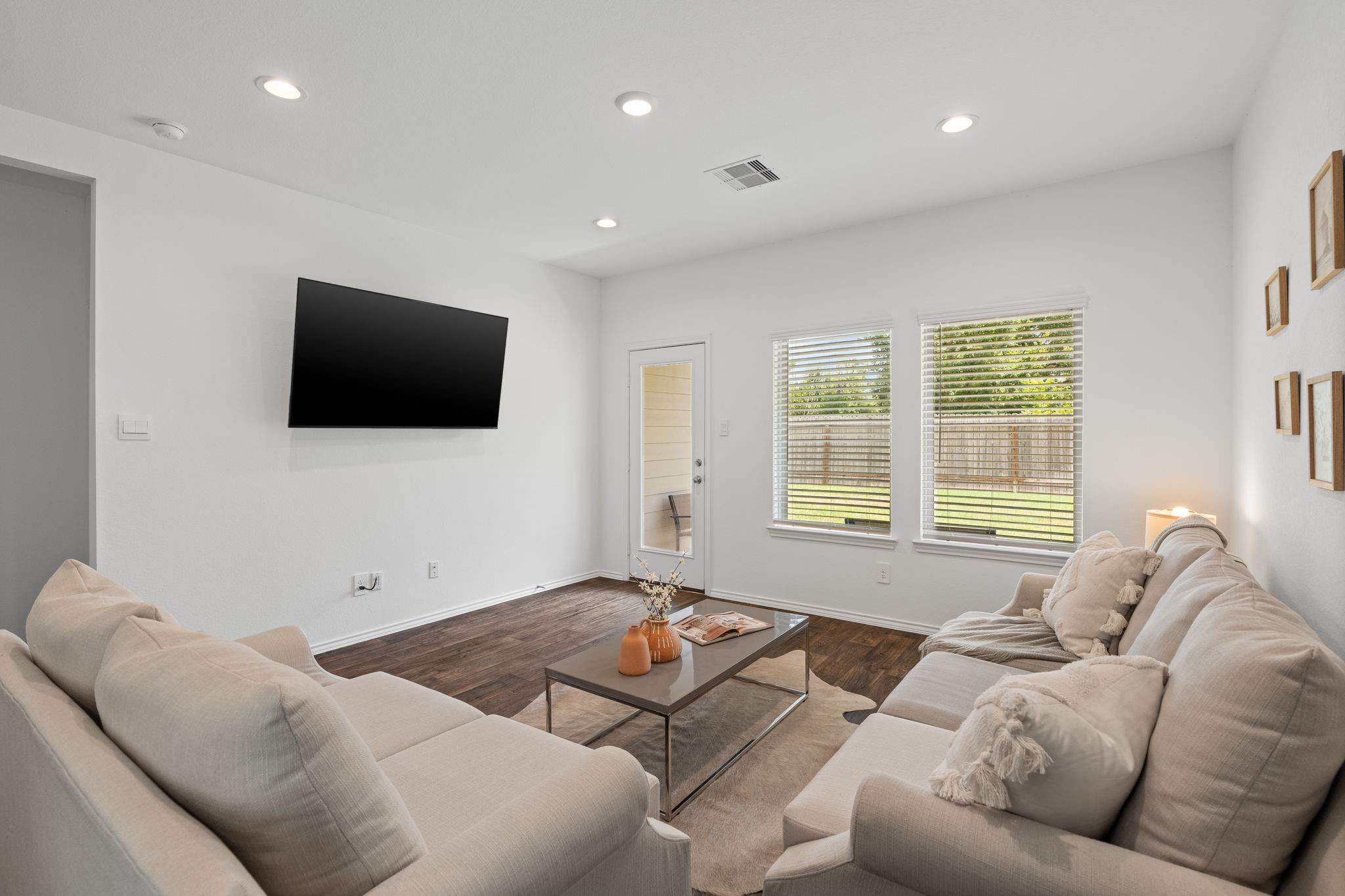 22306 Forest Gorge Lane Spring, TX 77373 - Photo 13 of 26 a living room with furniture and a flat screen tv