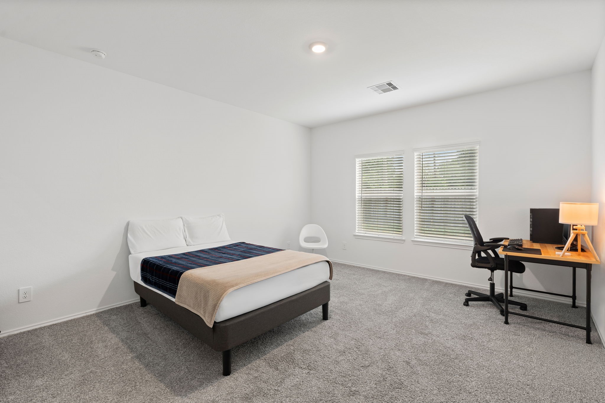 22306 Forest Gorge Lane Spring, TX 77373 - Photo 14 of 26 a bedroom with a bed chair and a window