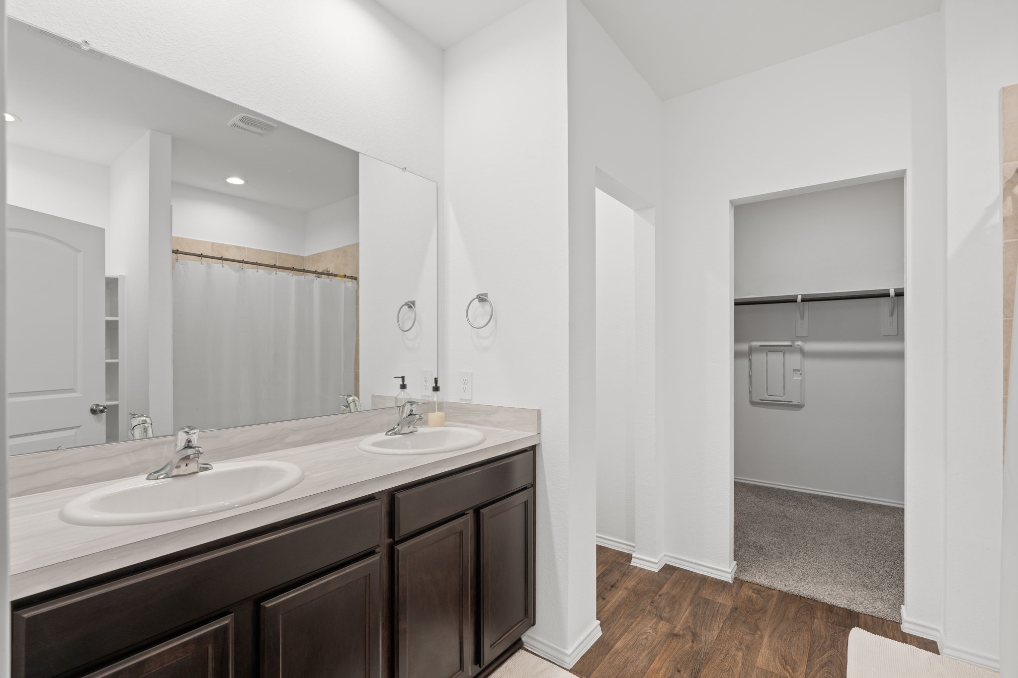22306 Forest Gorge Lane Spring, TX 77373 - Photo 15 of 26 a bathroom with a sink double vanity and a mirror