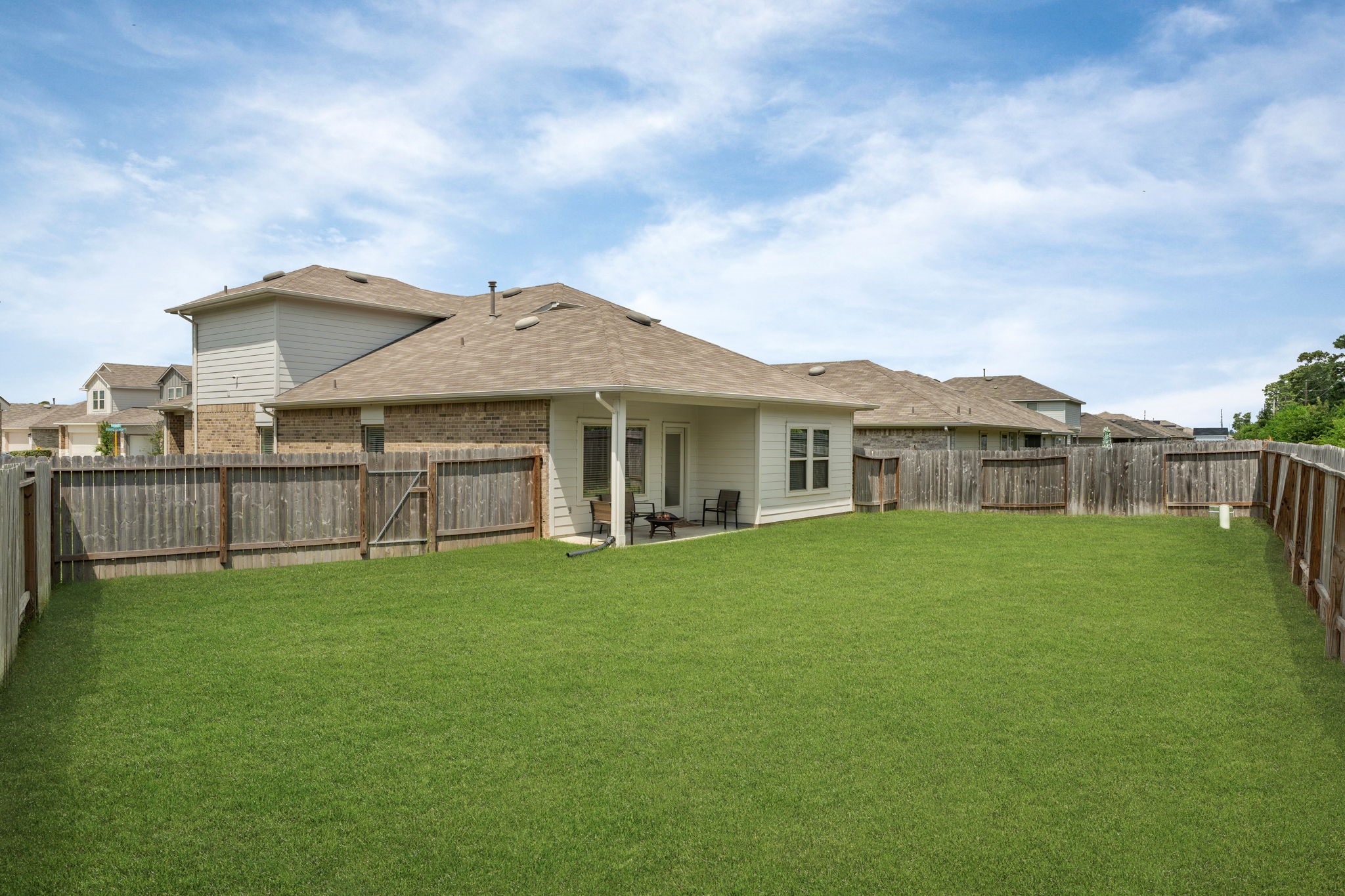 22306 Forest Gorge Lane Spring, TX 77373 - Photo 23 of 26 a view of a house with a backyard