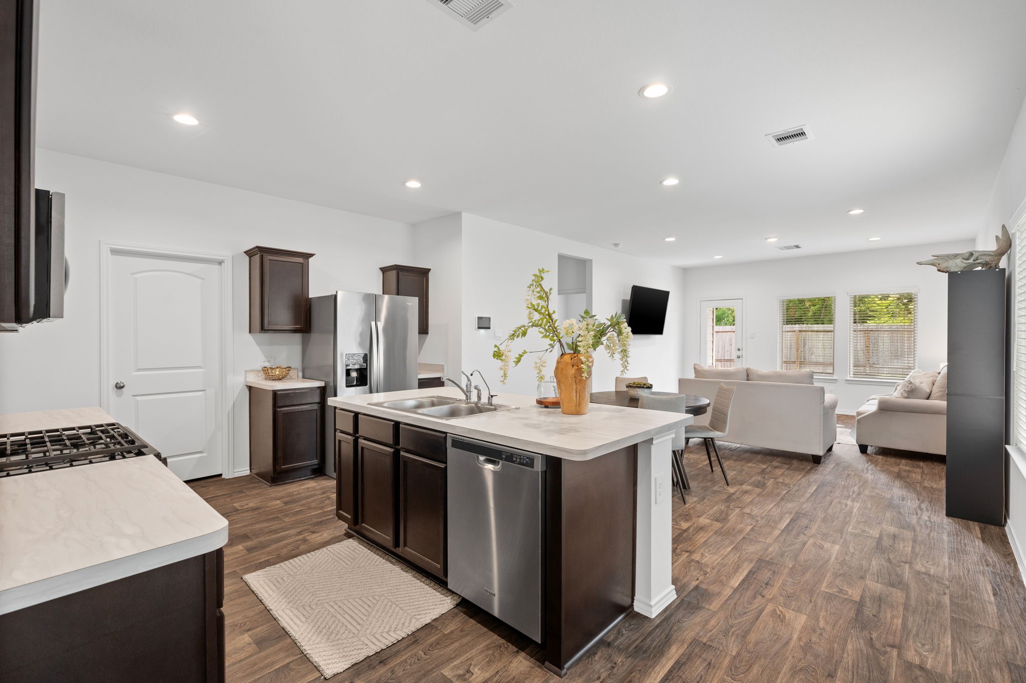 22306 Forest Gorge Lane Spring, TX 77373 - Photo 5 of 26 a kitchen with a sink stove and refrigerator