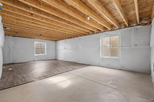 a view of an empty room with windows