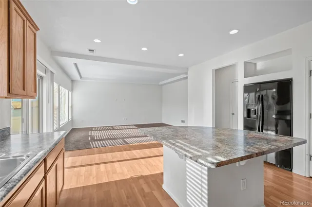 a view of a kitchen counter top space and wooden floor