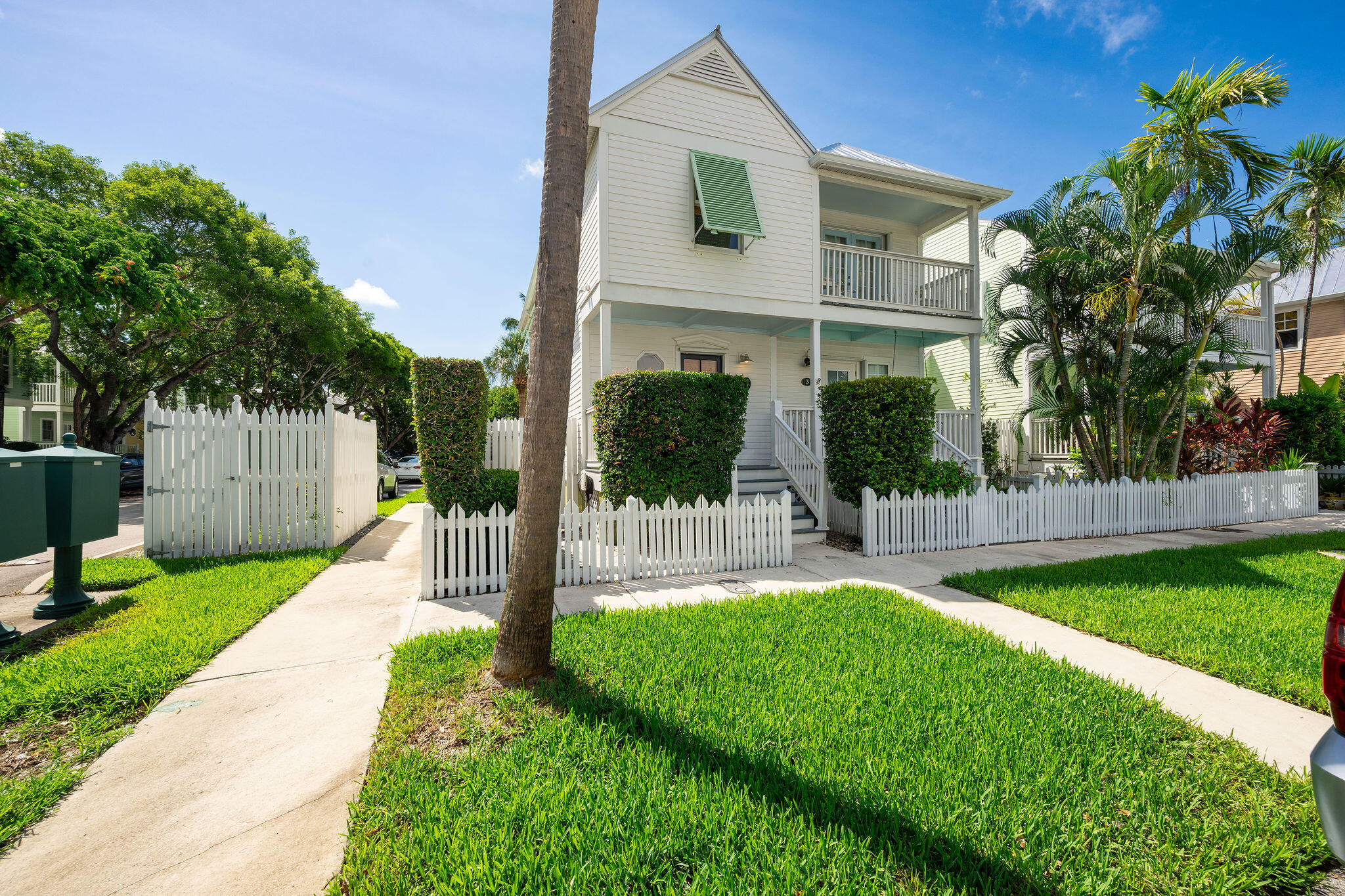 1 Spoonbill Way Key West, FL 33040 - Photo 3 of 38 a front view of a house with a yard and potted plants