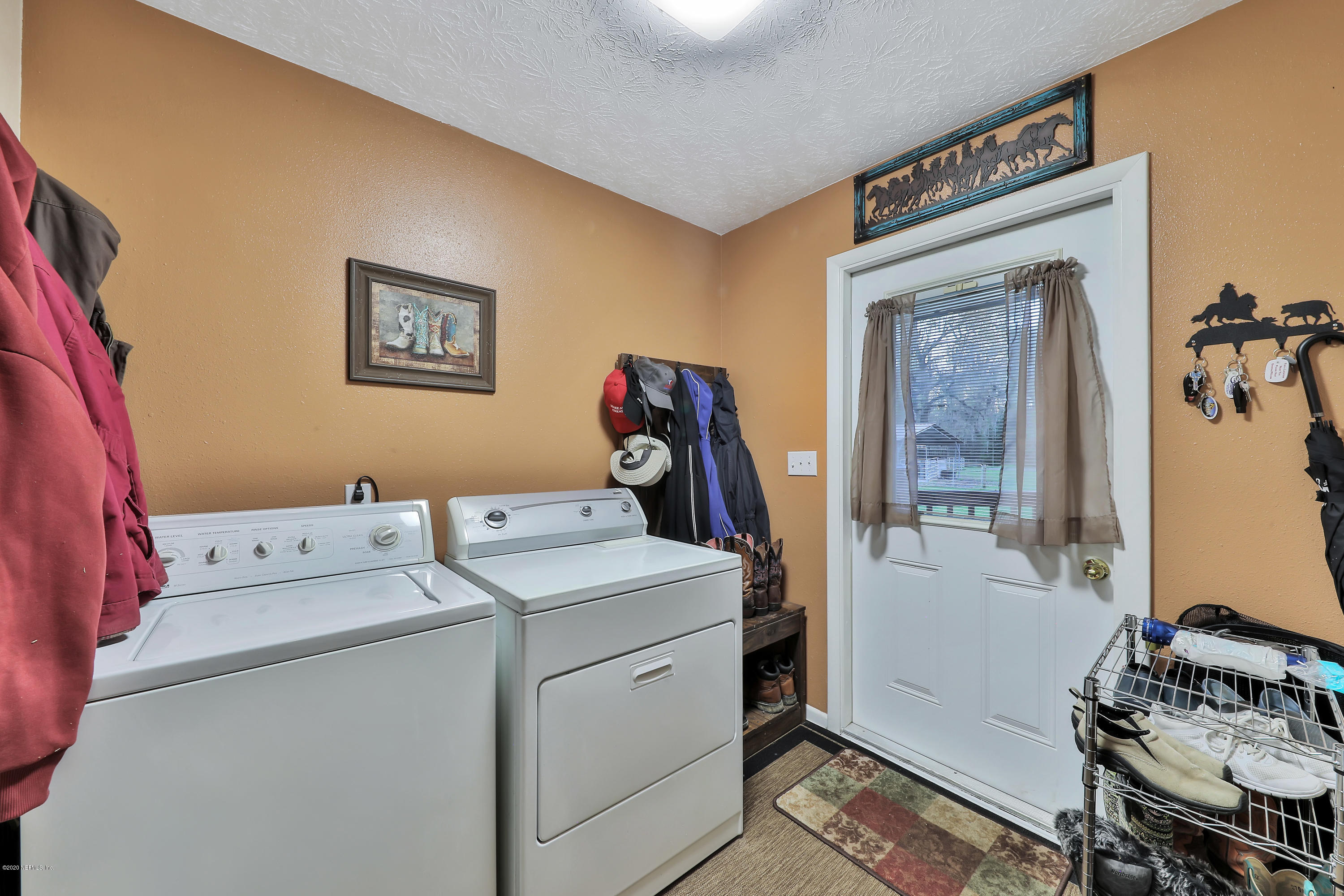 746 Worth Road St. Johns, FL 32259 - Photo 38 of 66 Laundry room with access to deck