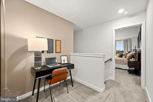 a bedroom with a bed and a chair