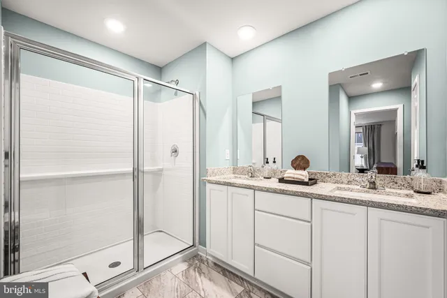 a view of storage and utility room with washer and dryer