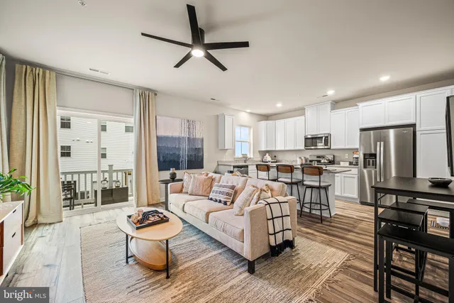 a kitchen with a stove a sink a refrigerator and glass cabinets