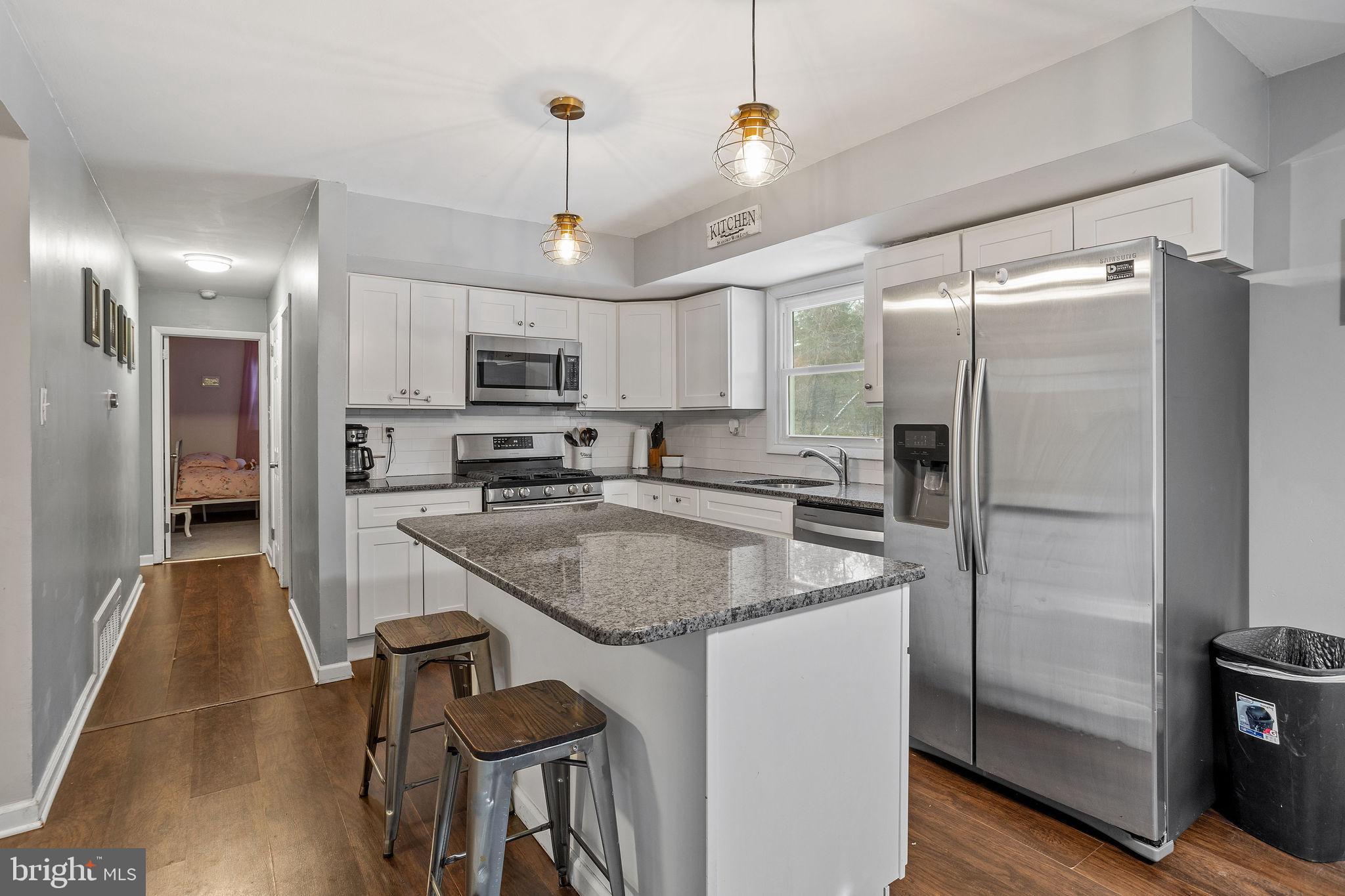 1 Ruby Avenue Sewell, NJ 08080 - Photo 16 of 32 a kitchen with stainless steel appliances granite countertop a refrigerator a stove a sink and a refrigerator