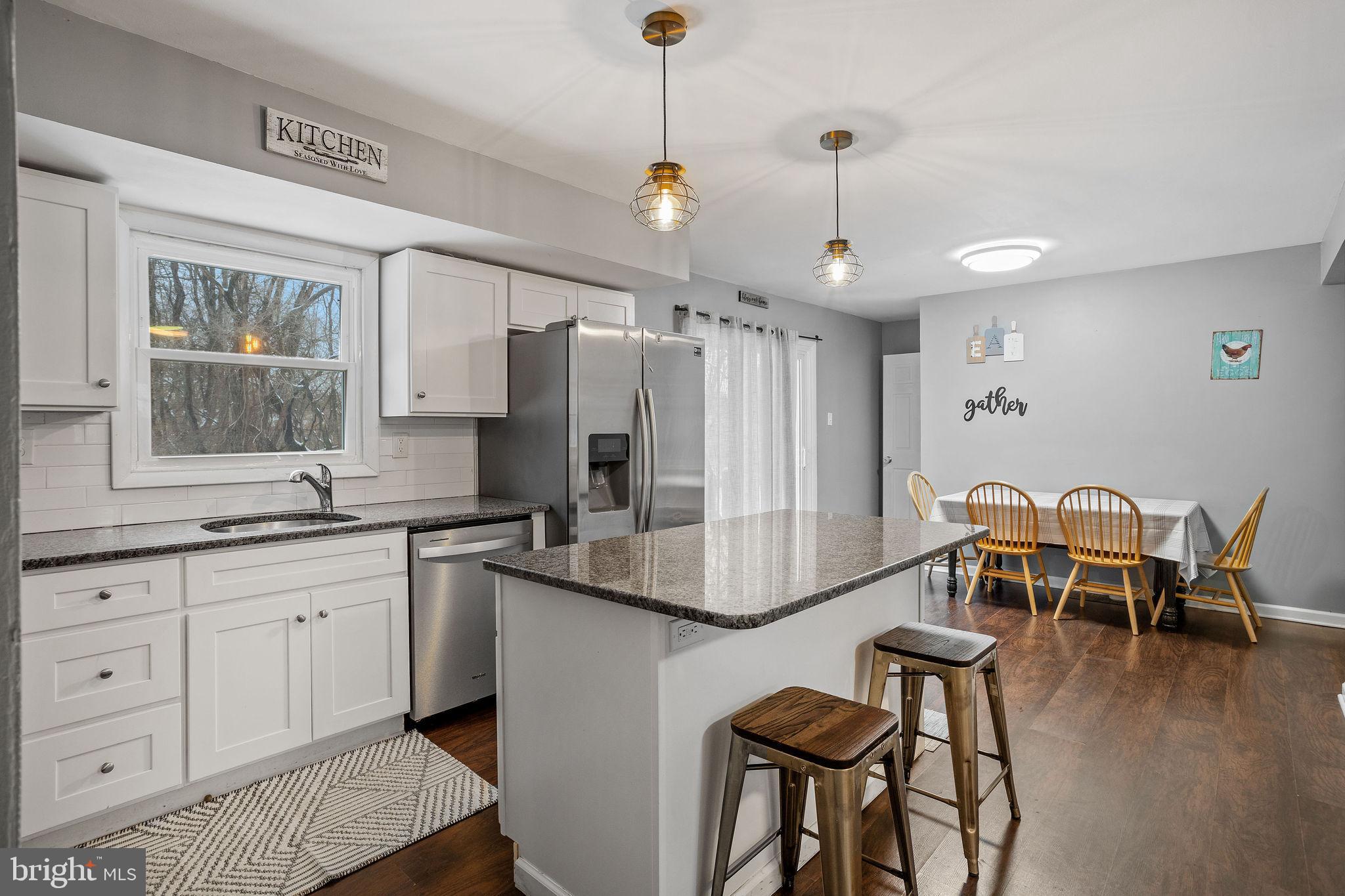 1 Ruby Avenue Sewell, NJ 08080 - Photo 17 of 32 a kitchen with granite countertop white cabinets and stainless steel appliances