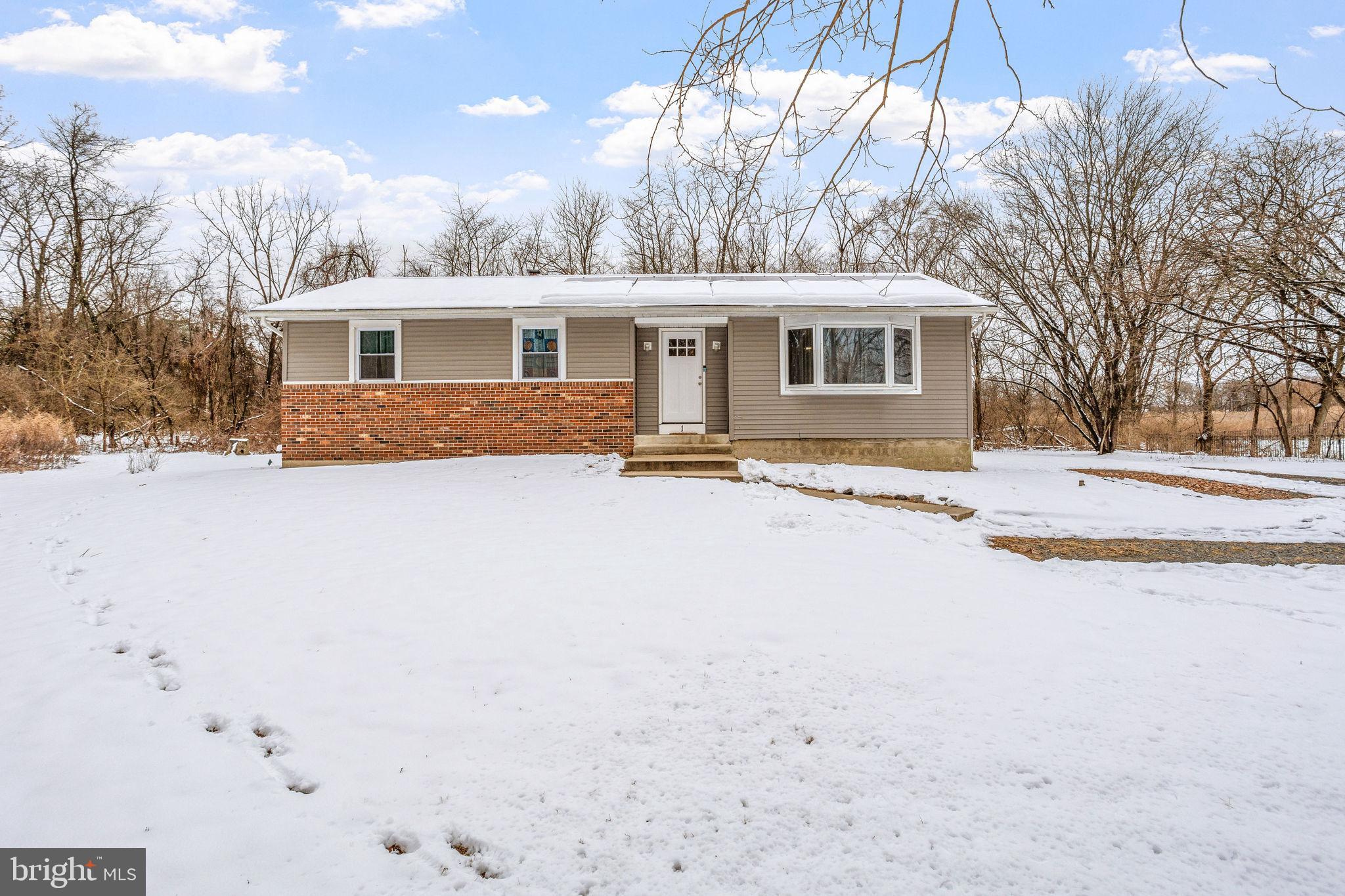 1 Ruby Avenue Sewell, NJ 08080 - Photo 2 of 32 a front view of a house with a yard covered with snow