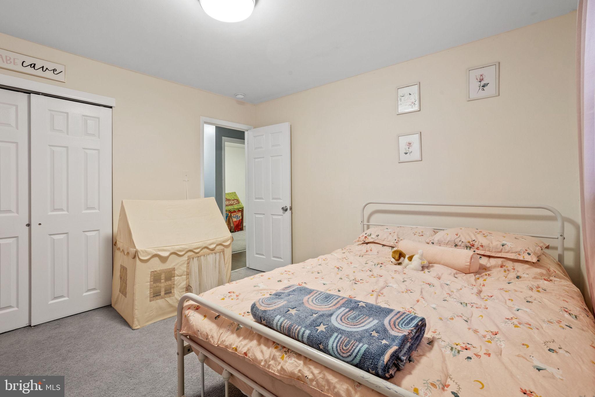 1 Ruby Avenue Sewell, NJ 08080 - Photo 22 of 32 a bedroom with a bed and a table in it