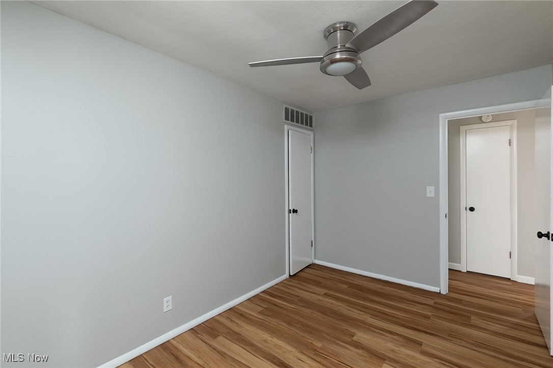 4782 Belle Meadow Road Mentor, OH 44060 - Photo 17 of 22 Unfurnished room featuring wood-type flooring and ceiling fan