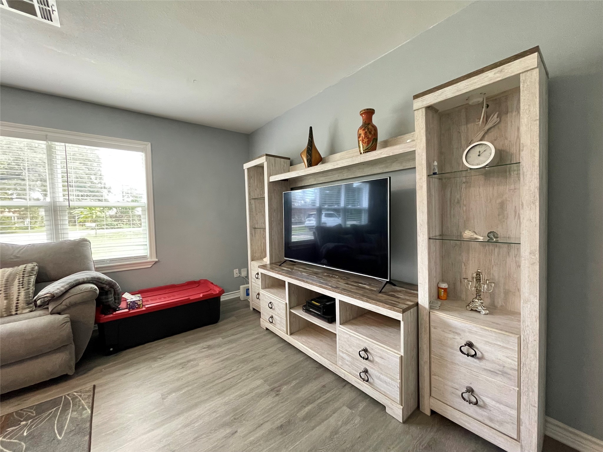 1116 Lake Street Clute, TX 77531 - Photo 11 of 34 a living room with furniture and flat screen tv