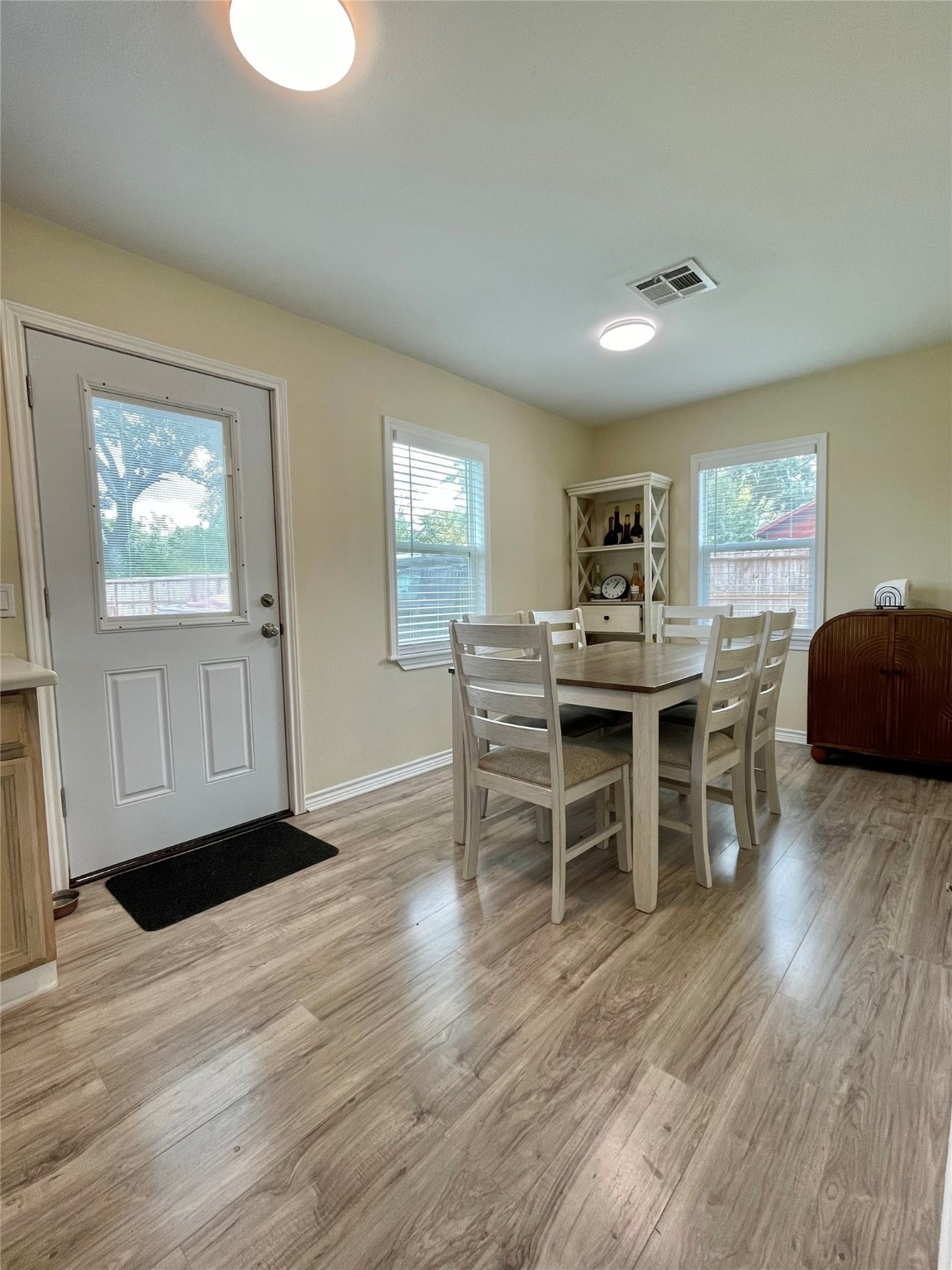 1116 Lake Street Clute, TX 77531 - Photo 19 of 34 a view of a dining room with furniture and wooden floor