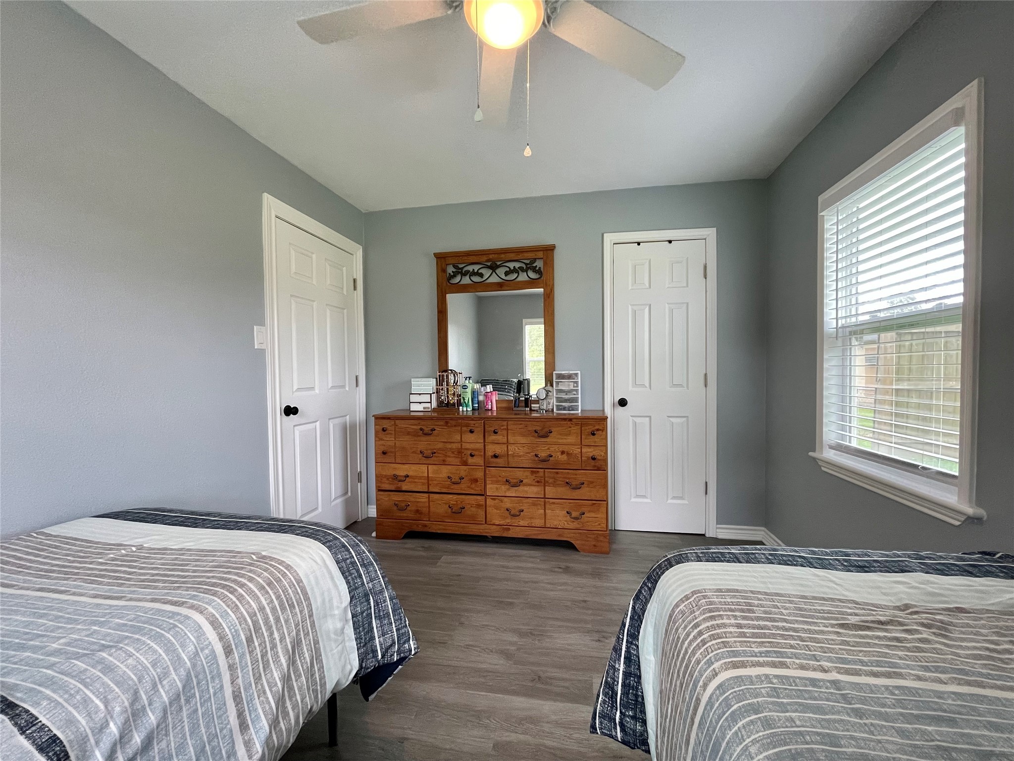 1116 Lake Street Clute, TX 77531 - Photo 24 of 34 a bedroom with a bed and a chandelier