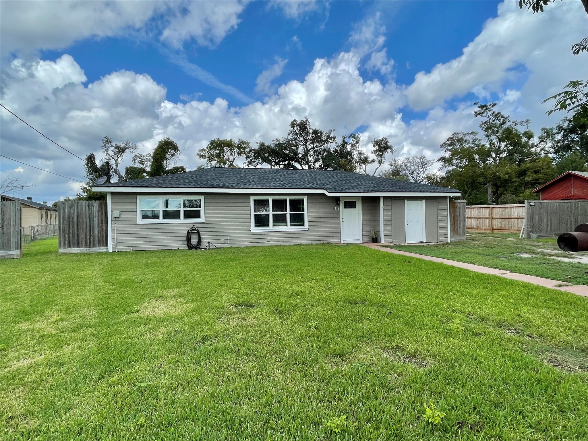 1116 Lake Street Clute, TX 77531 - Photo 3 of 34 front view of a house with a yard