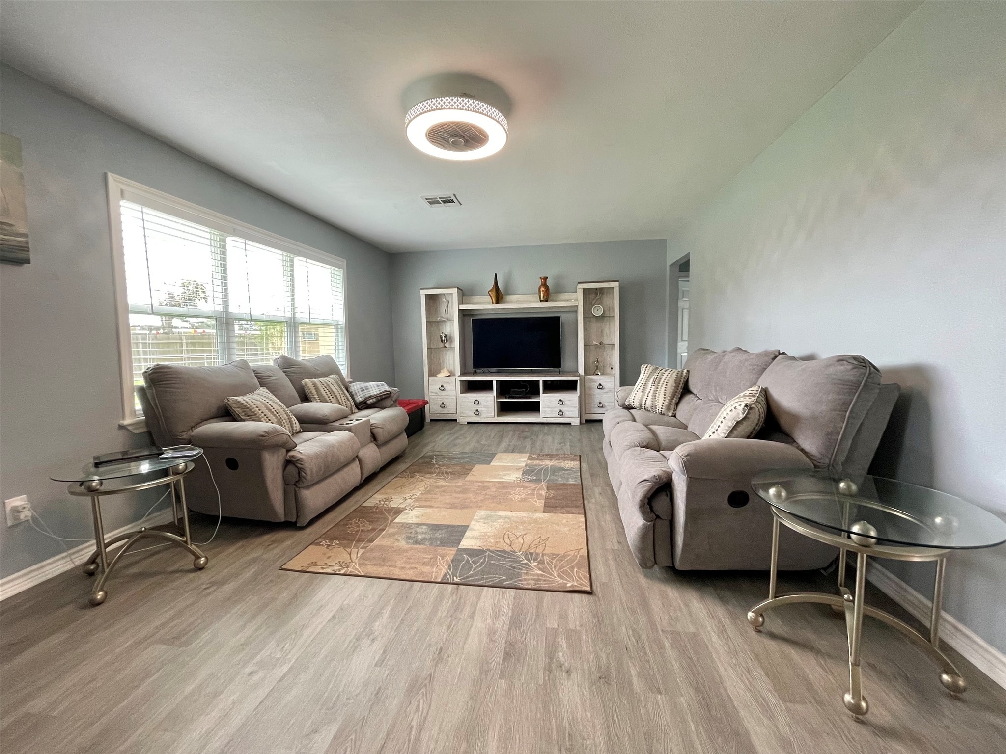 1116 Lake Street Clute, TX 77531 - Photo 8 of 34 a living room with furniture and a flat screen tv