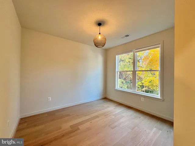 a bathroom with a double vanity sink mirror and toilet