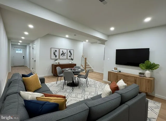 a view of a room with wooden floor