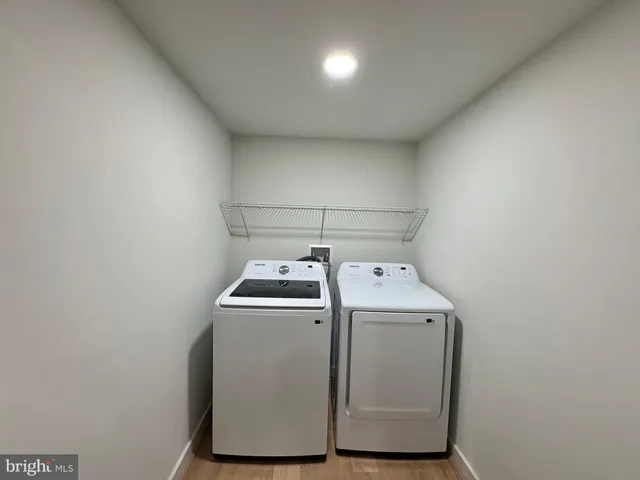 a view of backyard with wooden fence