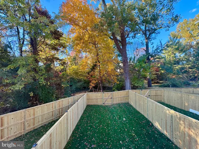 a kitchen with stainless steel appliances kitchen island granite countertop a refrigerator and a stove top oven