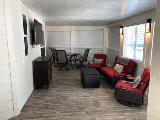 84136 Ave 44, Unit 694 Indio, CA 92203 - Photo 11 of 20 a living room with furniture windows and a flat screen tv