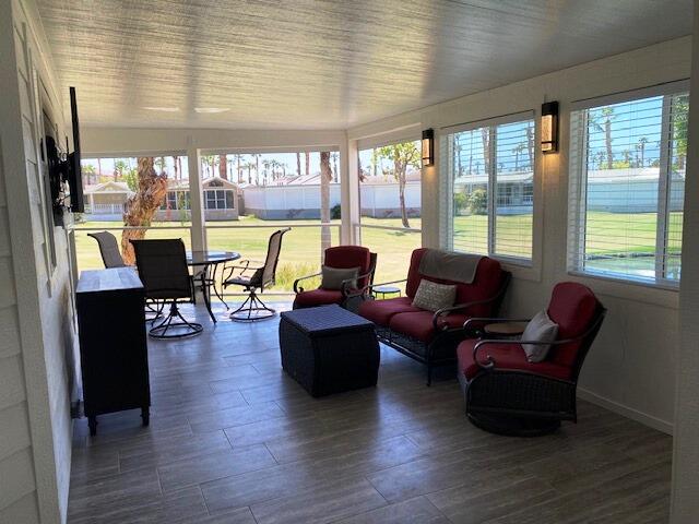 84136 Ave 44, Unit 694 Indio, CA 92203 - Photo 13 of 20 a living room with furniture and large windows