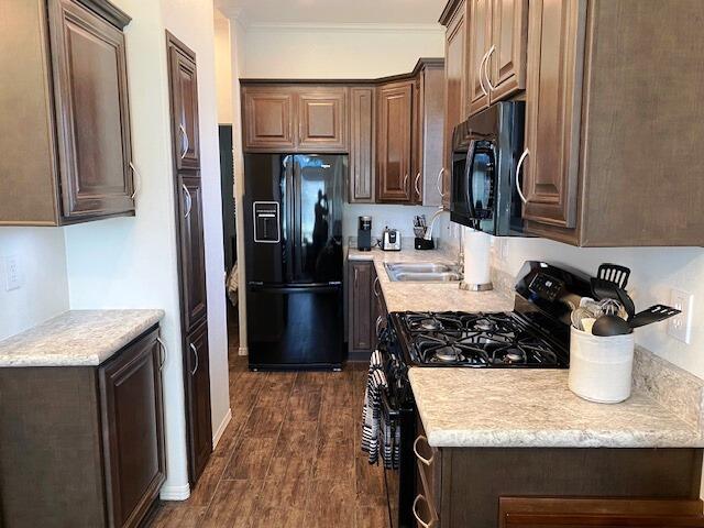 84136 Ave 44, Unit 694 Indio, CA 92203 - Photo 14 of 20 a kitchen with a refrigerator and a sink