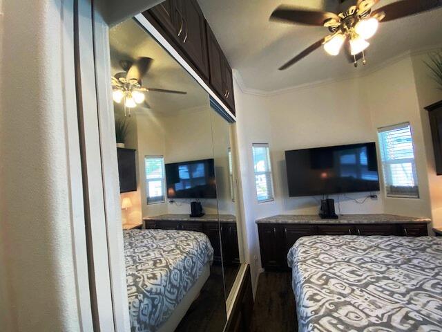 84136 Ave 44, Unit 694 Indio, CA 92203 - Photo 17 of 20 a bedroom with bed and flat screen tv