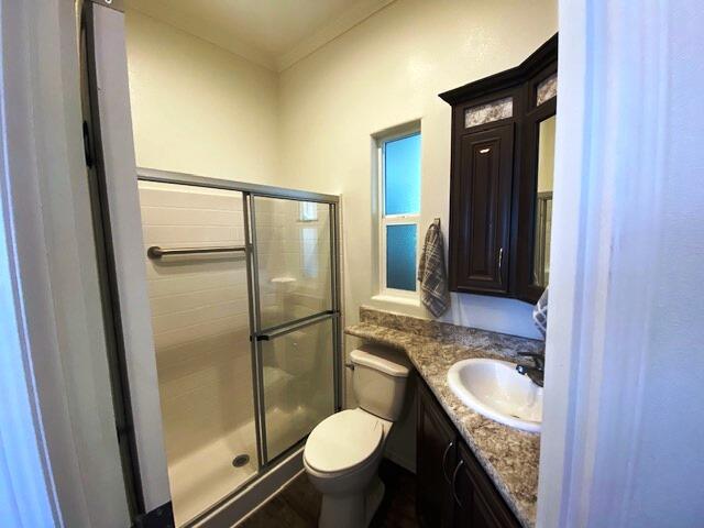 84136 Ave 44, Unit 694 Indio, CA 92203 - Photo 18 of 20 a bathroom with a granite countertop sink toilet and shower